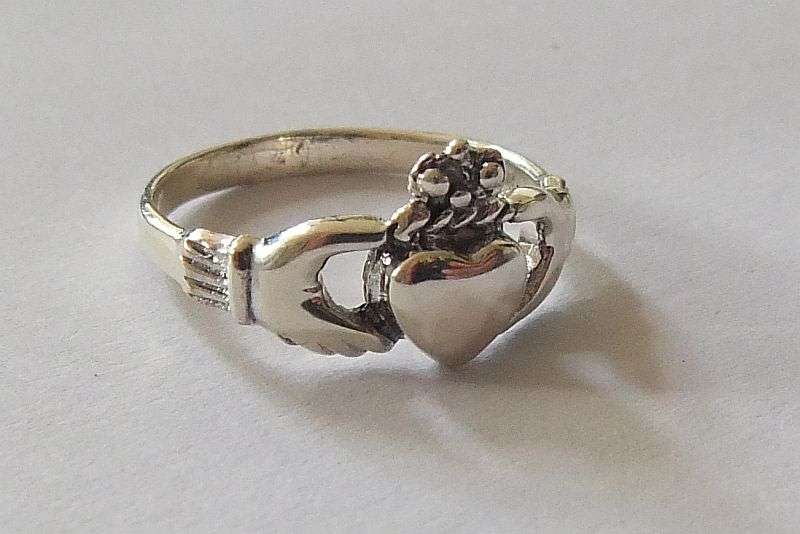 A Super cool Solid Sterling Silver Claddagh ring representing Love , Friendship and Loyalty !! WoW