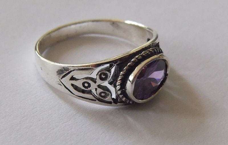 A Great Quality Solid Sterling Silver ring set with an Amethyst colored Cubic Zirconia !! WoW !!