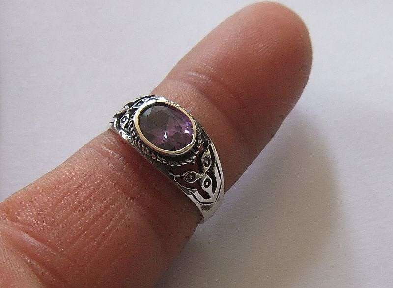 A Great Quality Solid Sterling Silver ring set with an Amethyst colored Cubic Zirconia !! WoW !!