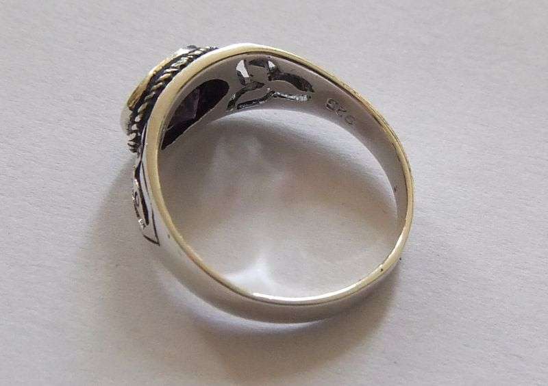 A Great Quality Solid Sterling Silver ring set with an Amethyst colored Cubic Zirconia !! WoW !!