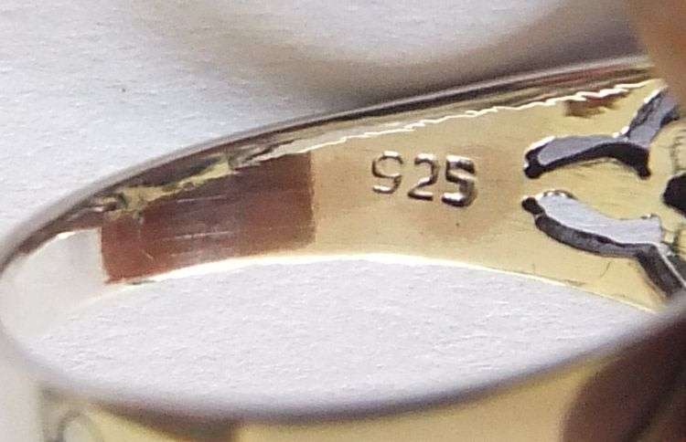 A Great Quality Solid Sterling Silver ring set with an Amethyst colored Cubic Zirconia !! WoW !!