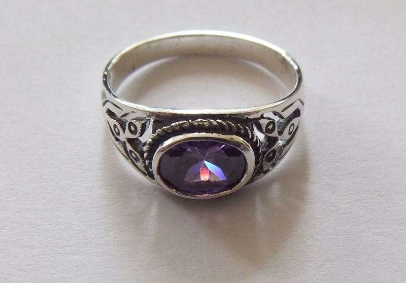 A Great Quality Solid Sterling Silver ring set with an Amethyst colored Cubic Zirconia !! WoW !!