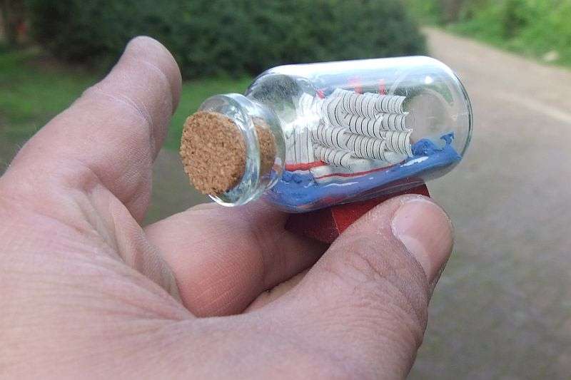 FOR HIM & HER !! A CUTE BOAT IN A BOTTLE AND A VINTAGE CARVED BONE BANGLE !! BID FOR BOTH !!