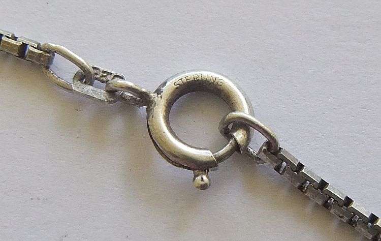 A QUALITY VINTAGE STERLING SILVER NECKLACE WITH A DESIGNER STAMPED STERLING SILVER CROSS PENDANT !!