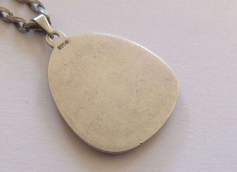 AN UNUSUAL SOLID STERLING SILVER VINTAGE DESIGNER STAMPED ST CHRISTOPHER WITH STERLING SILVER CHAIN