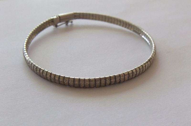 A VERY SMART UNUSUAL SOLID STERLING SILVER BRACELET WITH SAFETY CATCH CLASP !! CHECK IT OUT !!