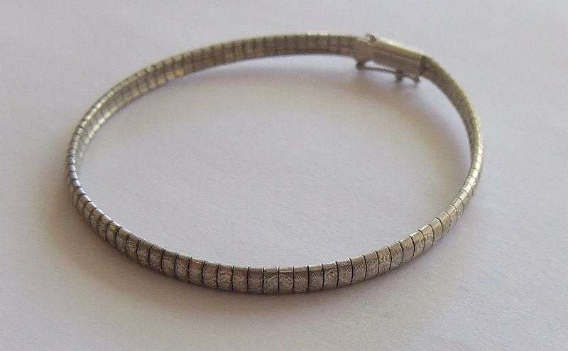 A VERY SMART UNUSUAL SOLID STERLING SILVER BRACELET WITH SAFETY CATCH CLASP !! CHECK IT OUT !!