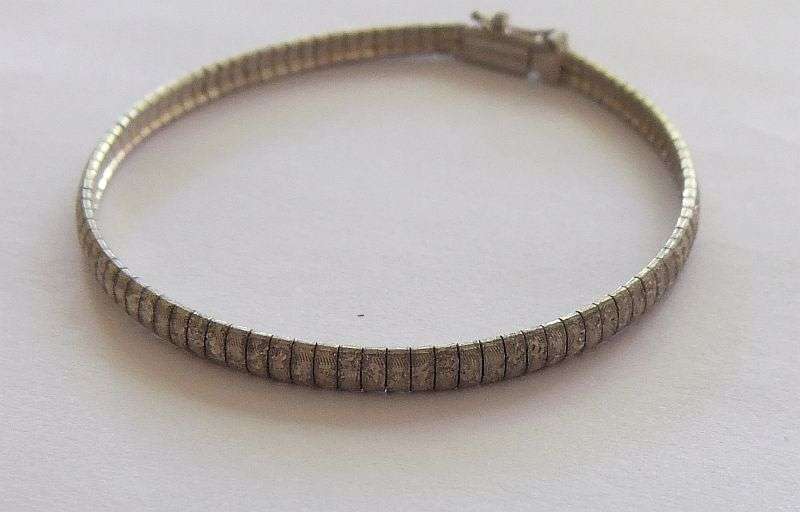 A VERY SMART UNUSUAL SOLID STERLING SILVER BRACELET WITH SAFETY CATCH CLASP !! CHECK IT OUT !!