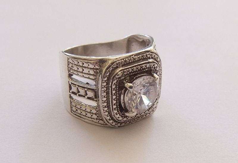 A GREAT QUALITY BIG , BOLD , BEAUTIFUL SOLID STERLING SILVER RING SET WITH A BIG FACETED CZ STONE