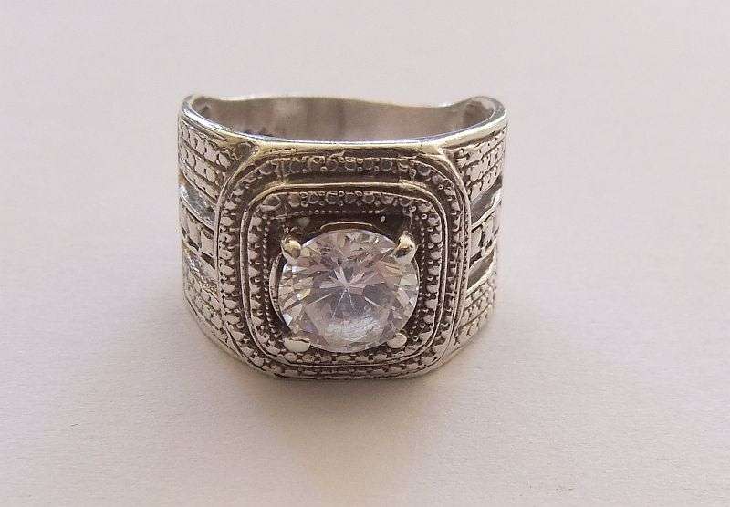 A GREAT QUALITY BIG , BOLD , BEAUTIFUL SOLID STERLING SILVER RING SET WITH A BIG FACETED CZ STONE