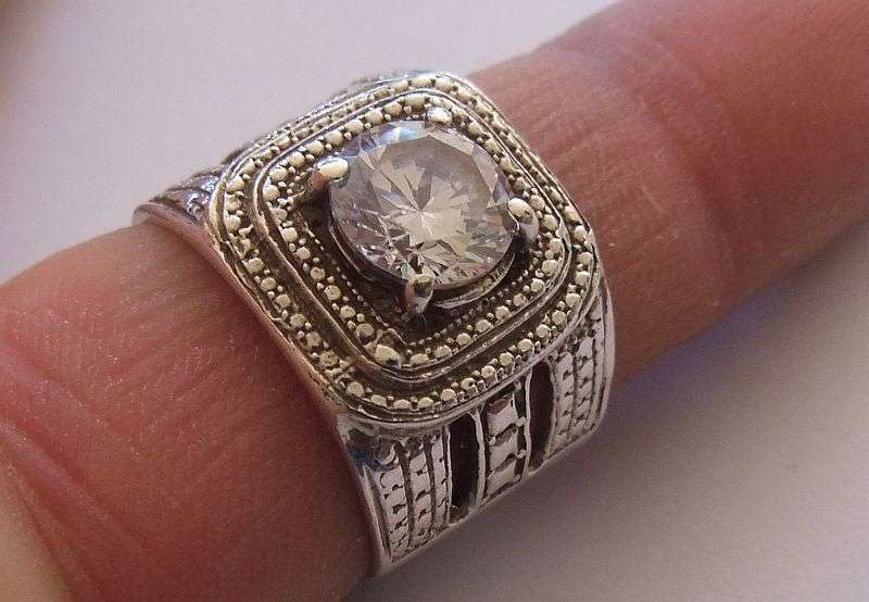 A GREAT QUALITY BIG , BOLD , BEAUTIFUL SOLID STERLING SILVER RING SET WITH A BIG FACETED CZ STONE