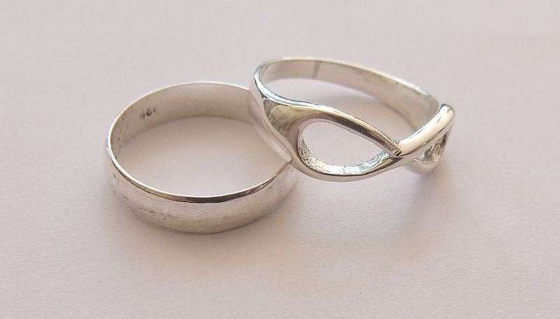GOOD DEAL !! TWO SOLID STERLING SILVER RINGS !! WEDDING BAND AND ETERNITY RING !! BID FOR BOTH !!