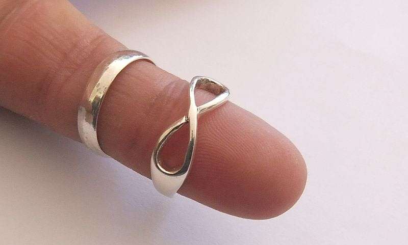 GOOD DEAL !! TWO SOLID STERLING SILVER RINGS !! WEDDING BAND AND ETERNITY RING !! BID FOR BOTH !!