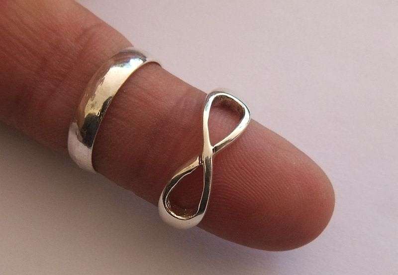 GOOD DEAL !! TWO SOLID STERLING SILVER RINGS !! WEDDING BAND AND ETERNITY RING !! BID FOR BOTH !!