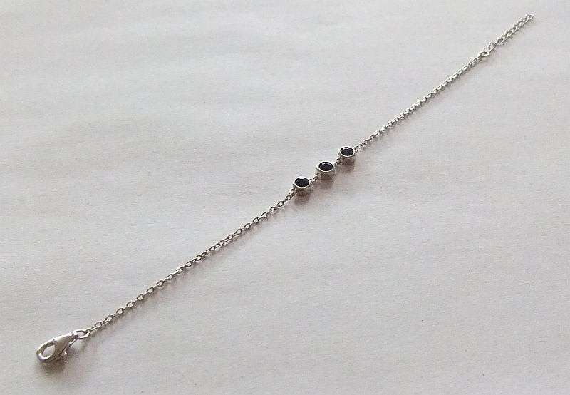 A PETITE YET ELEGANT SOLID STERLING SILVER BRACELET SET WITH 3 FACETED BLUE STONES !! BRAND NEW !!