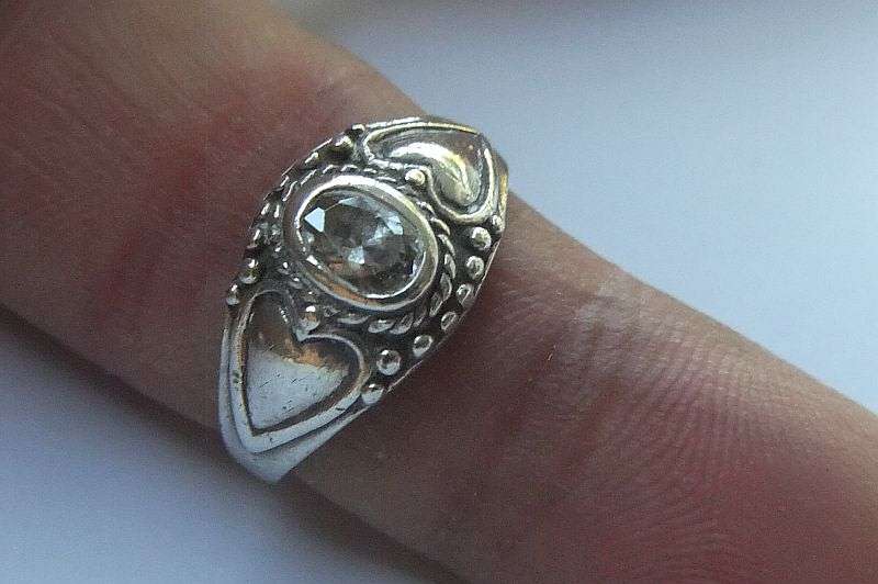 WOW !! A FABULOUS SOLID STERLING SILVER RING SET WITH A FACETED CLEAR STONE !!