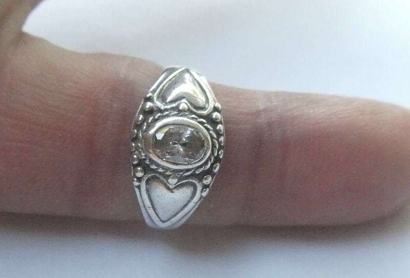 WOW !! A FABULOUS SOLID STERLING SILVER RING SET WITH A FACETED CLEAR STONE !!