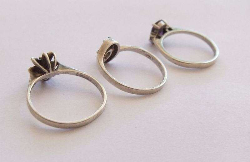 SUPER DEAL !! THREE STYLISH SOLID STERLING SILVER RINGS ... FACETED PURPLE STONE , CLUSTER ETC !!