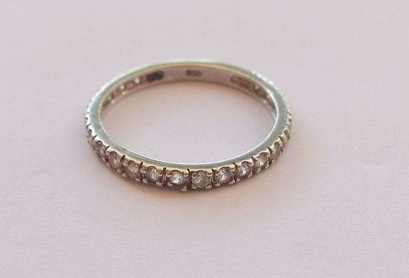 AN ELEGANT SOLID STERLING SILVER HALF ETERNITY RING TO ACCENTUATE YOUR OTHER BEAUTIFUL PIECES !!