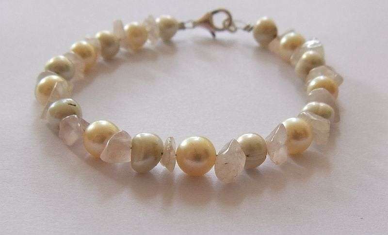 A GENUINE AKOYA PEARL , ROSE QUARTZ AND OTHER FRESHWATER PEARL BRACELET WITH STERLING SILVER CLASP