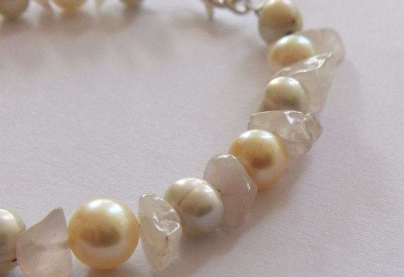 A GENUINE AKOYA PEARL , ROSE QUARTZ AND OTHER FRESHWATER PEARL BRACELET WITH STERLING SILVER CLASP