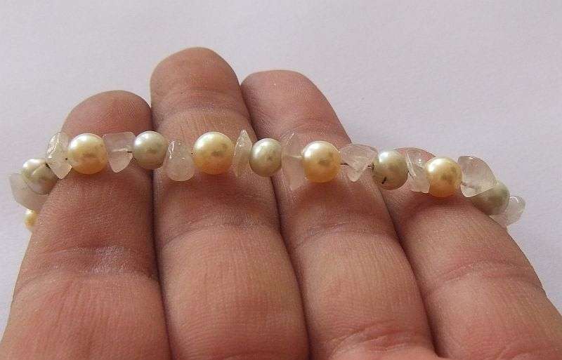 A GENUINE AKOYA PEARL , ROSE QUARTZ AND OTHER FRESHWATER PEARL BRACELET WITH STERLING SILVER CLASP