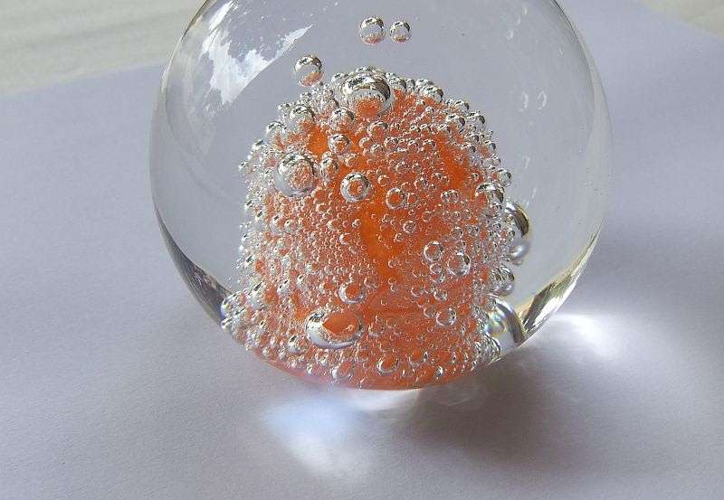 A DAMAGE FREE VINTAGE GENUINE MURANO SOLID GLASS PAPERWEIGHT WITH ORANGE "EXPLOSION " ...LOVE IT !!