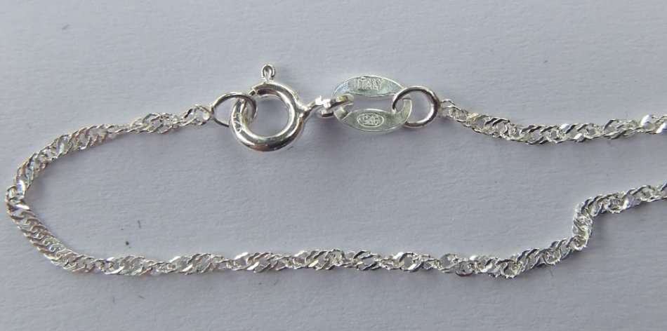 WHAT MORE !! A STERLING SILVER NECKLACE WITH TREE OF LIFE , AN ETERNITY RING PLUS SILVER EARRINGS !!