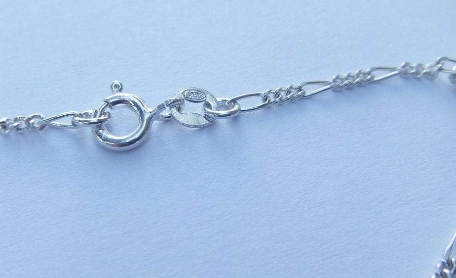 A LOVELY VINTAGE STYLE STERLING SILVER CHARM BRACELET WITH A FEW HOLLOW STARTER CHARMS !! SWEET !!