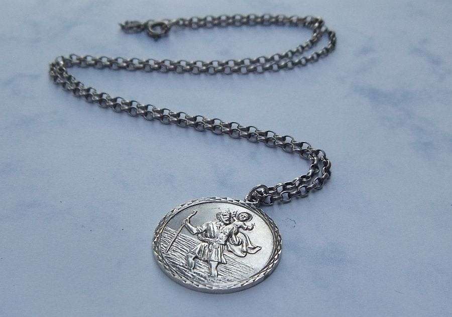 A BIGGER THAN USUAL DETAILED STERLING SILVER ST. CHRISTOPHER PENDANT AND HALLMARKED SILVER NECKLACE