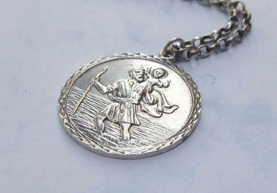 A BIGGER THAN USUAL DETAILED STERLING SILVER ST. CHRISTOPHER PENDANT AND HALLMARKED SILVER NECKLACE