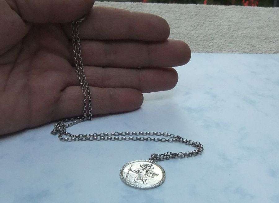 A BIGGER THAN USUAL DETAILED STERLING SILVER ST. CHRISTOPHER PENDANT AND HALLMARKED SILVER NECKLACE