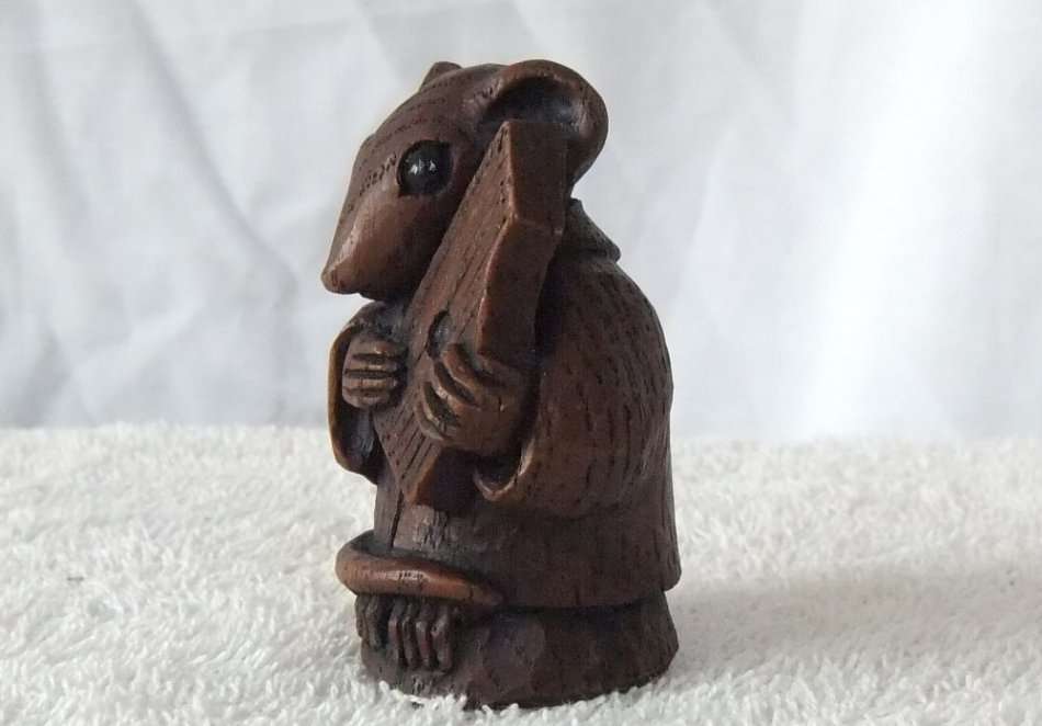 AN ADORABLE VINTAGE MOUSE WITH HARP ORNAMENT ..LOOKS LIKE CARVED WOOD BUT HEAVY LIKE RESIN ...NICE