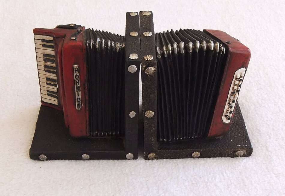 WOW !! A STUNNING HEAVY SOLID RESIN COMPOSITE PAIR OF BOOK ENDS IN THE FORM OF A PIANO ACCORDIAN !!
