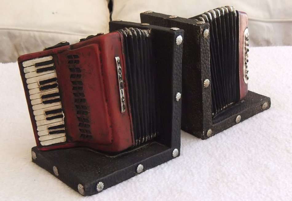 WOW !! A STUNNING HEAVY SOLID RESIN COMPOSITE PAIR OF BOOK ENDS IN THE FORM OF A PIANO ACCORDIAN !!