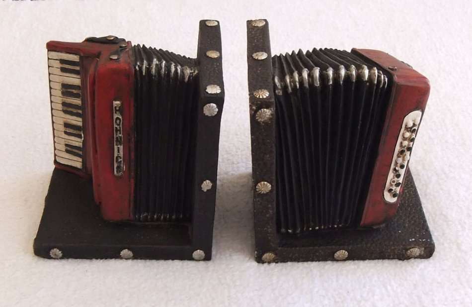 WOW !! A STUNNING HEAVY SOLID RESIN COMPOSITE PAIR OF BOOK ENDS IN THE FORM OF A PIANO ACCORDIAN !!
