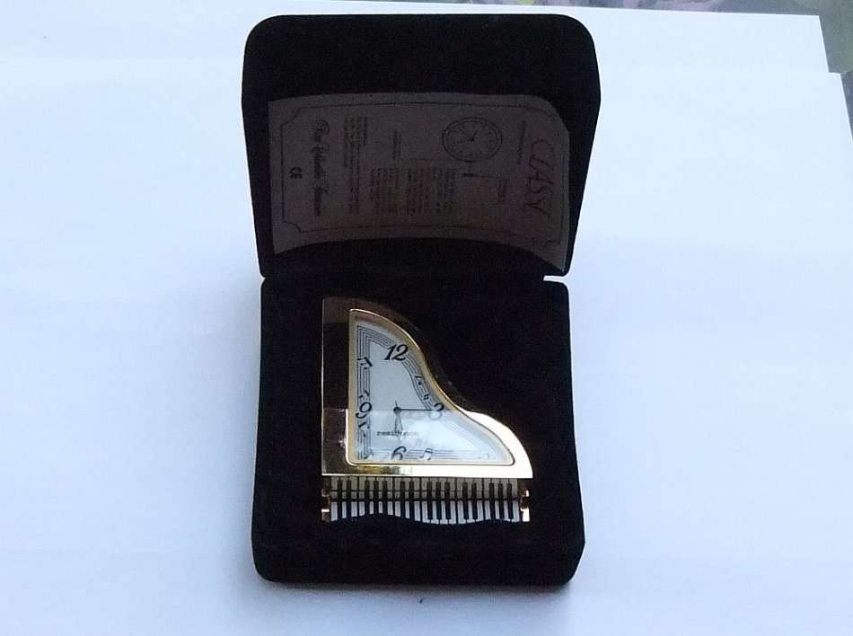 A NOTEWORTHY FIND !! PERFECT GIFT !! A VERY HEAVY FOR SIZE METAL CLOCK IN PIANO FORM WITH BOX !! WOW