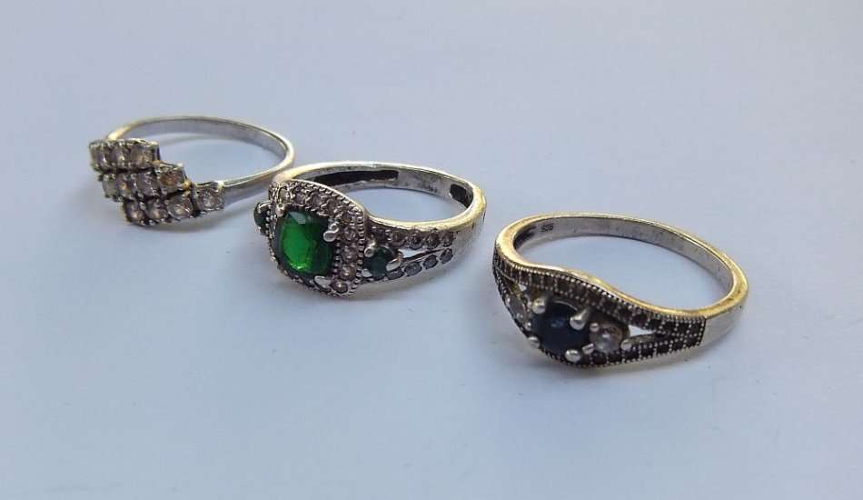 BLING BLING !! A STUNNING LOT OF THREE SOLID STERLING SILVER RINGS SET WITH LOTS OF FACETED STONES