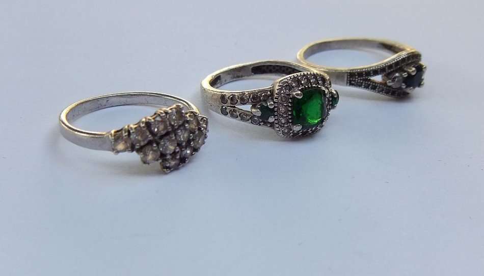 BLING BLING !! A STUNNING LOT OF THREE SOLID STERLING SILVER RINGS SET WITH LOTS OF FACETED STONES