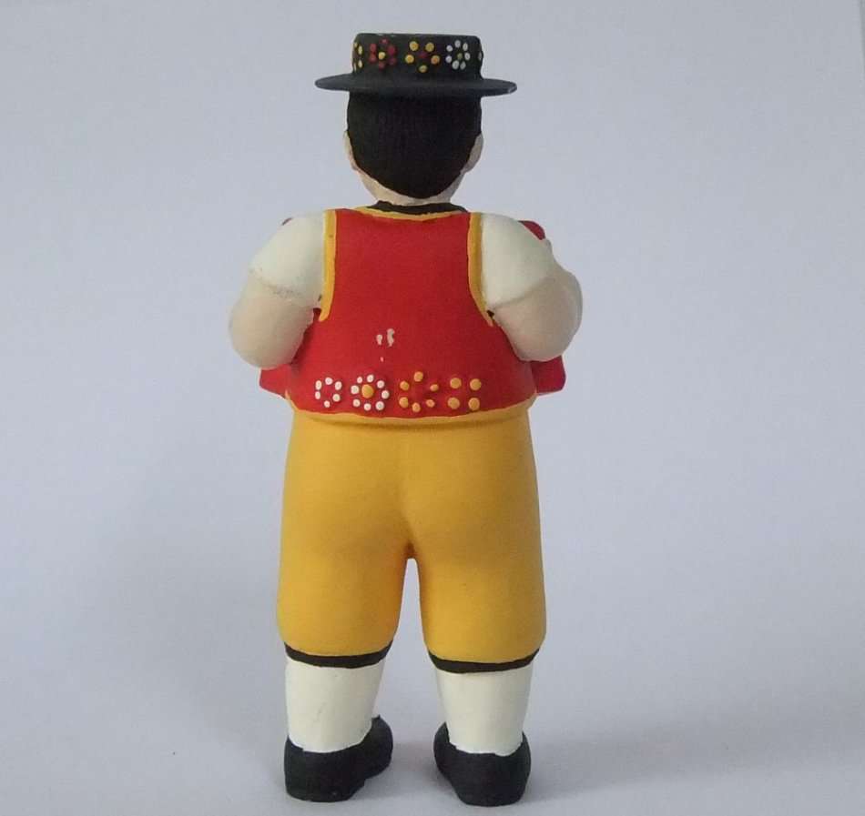 A STUNNING HAND MADE HAND PAINTED VINTAGE MUSICIAN FIGURE PLAYING THE ACCORDIAN FROM SWITZERLAND !!