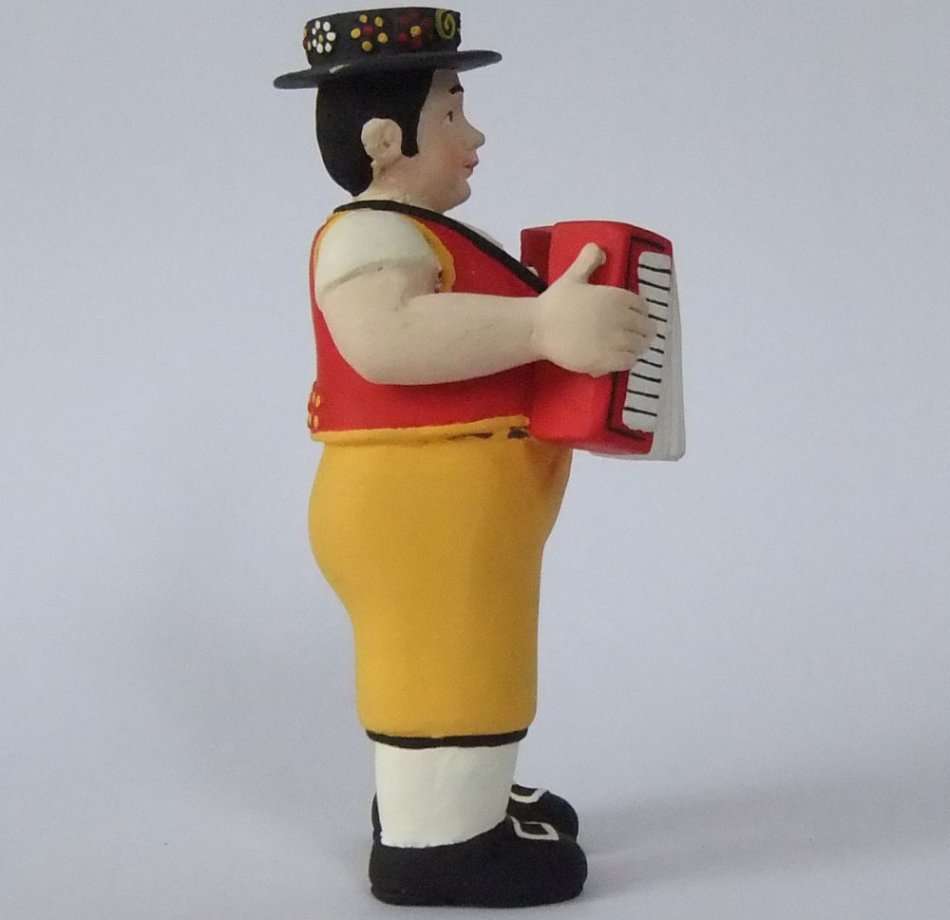 A STUNNING HAND MADE HAND PAINTED VINTAGE MUSICIAN FIGURE PLAYING THE ACCORDIAN FROM SWITZERLAND !!