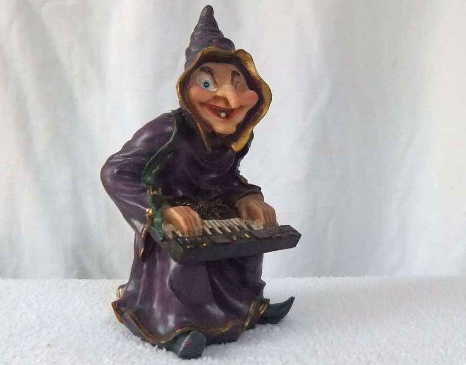 WHAT HAVE WE HERE !! A LARGE HAND PAINTED FIGURE OF A KEYBOARD PLAYING ONE TOOTHED WITCH !!