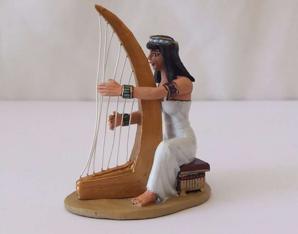 A GORGEOUS HAND PAINTED SOLID LEAD MODEL OF AN EGYPTIAN GODDESS PLAYING THE HARP BY KING & COUNTRY`S