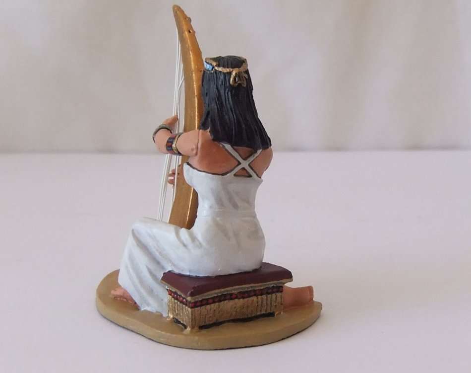 A GORGEOUS HAND PAINTED SOLID LEAD MODEL OF AN EGYPTIAN GODDESS PLAYING THE HARP BY KING & COUNTRY`S