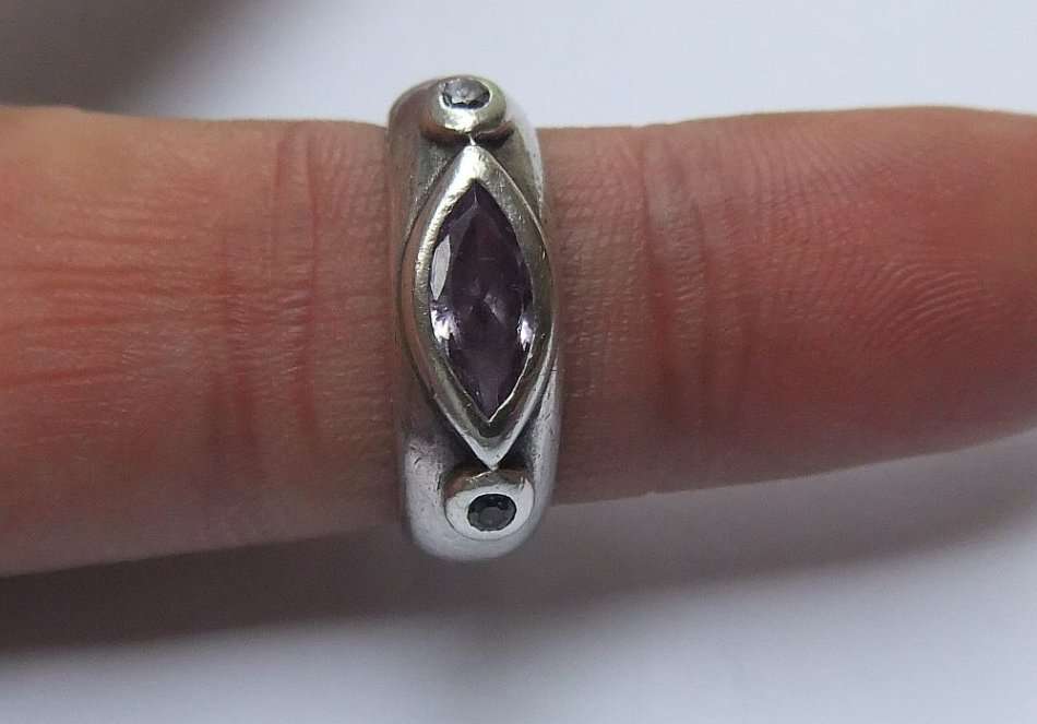 WOW !! A BEAUTIFUL SOLID STERLING SILVER RING SET WITH A FACETED PURPLE STONE AND TWO TINY STONES !!