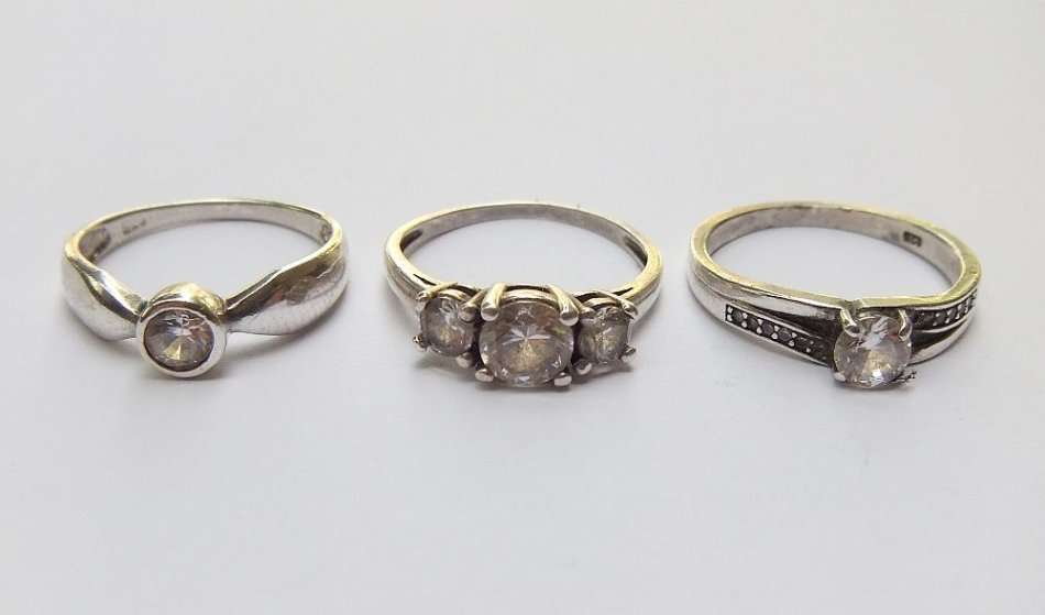 THREE ABSOLUTELY GORGEOUS SOLID STERLING SILVER RINGS SET WITH CUBIC ZIRCONIAS !! BID FOR THE LOT !!