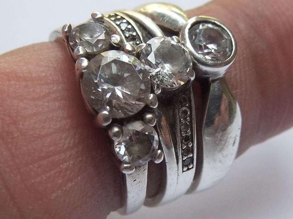 THREE ABSOLUTELY GORGEOUS SOLID STERLING SILVER RINGS SET WITH CUBIC ZIRCONIAS !! BID FOR THE LOT !!