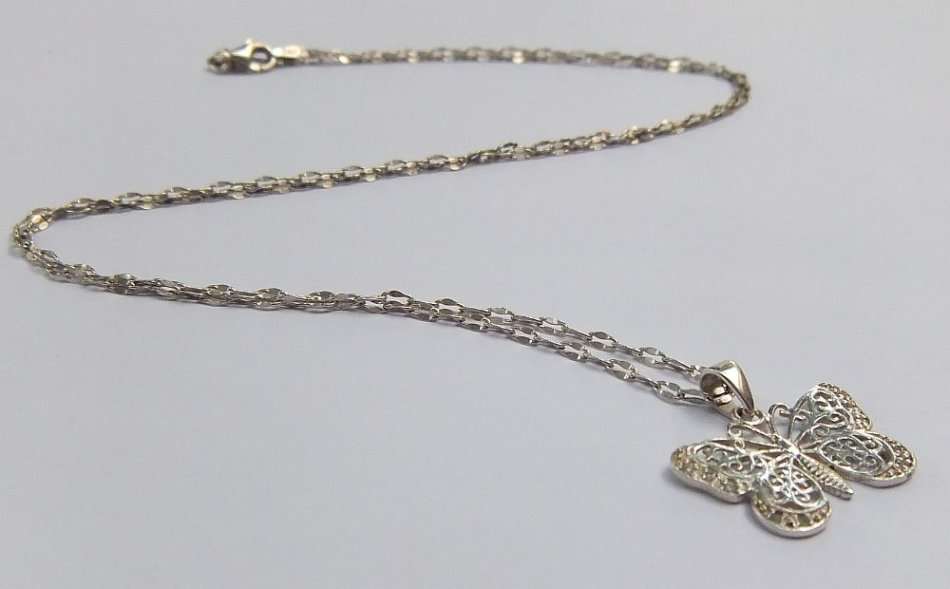 A CLASSY FILIGREE LOOK STERLING SILVER BUTTERFLY PENDANT WITH A UNIQUE STERLING SILVER NECKLACE !!