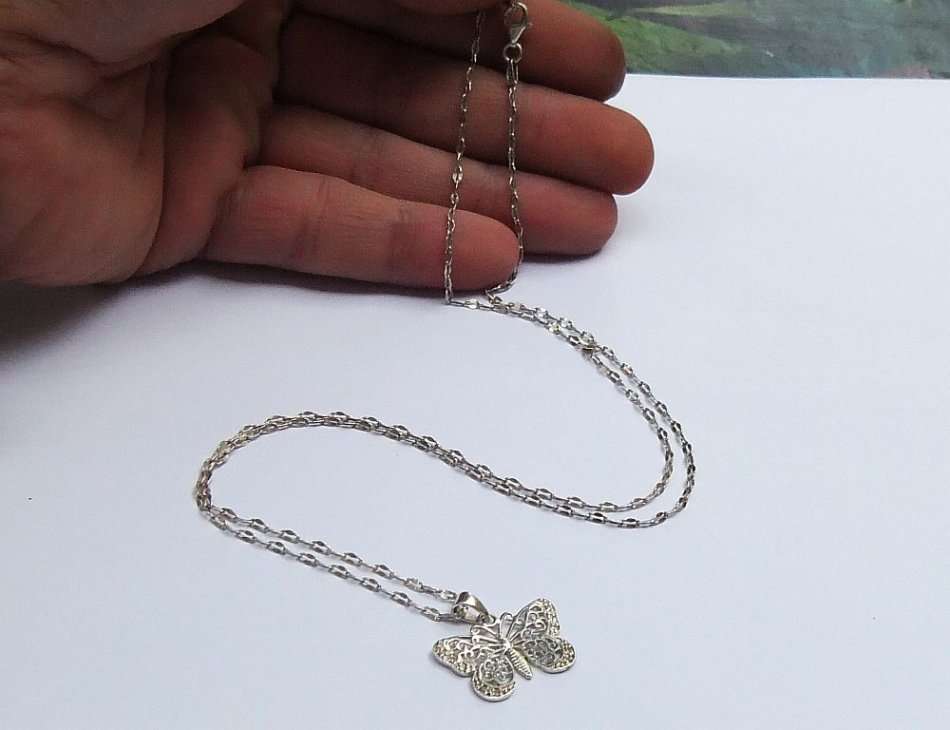 A CLASSY FILIGREE LOOK STERLING SILVER BUTTERFLY PENDANT WITH A UNIQUE STERLING SILVER NECKLACE !!