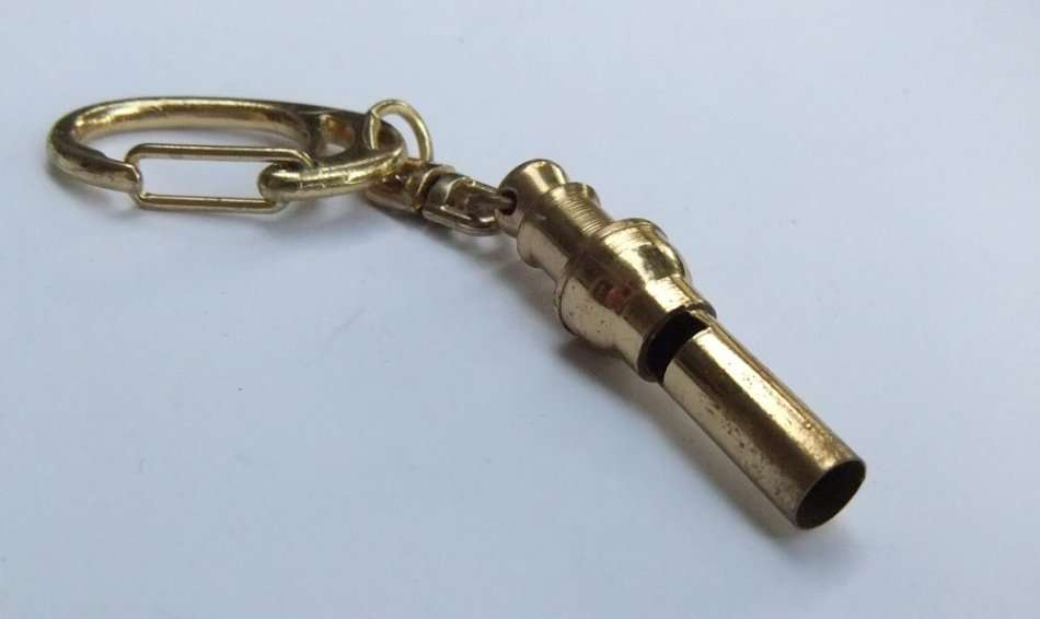 A VINTAGE METAL WHISTLE KEYRING